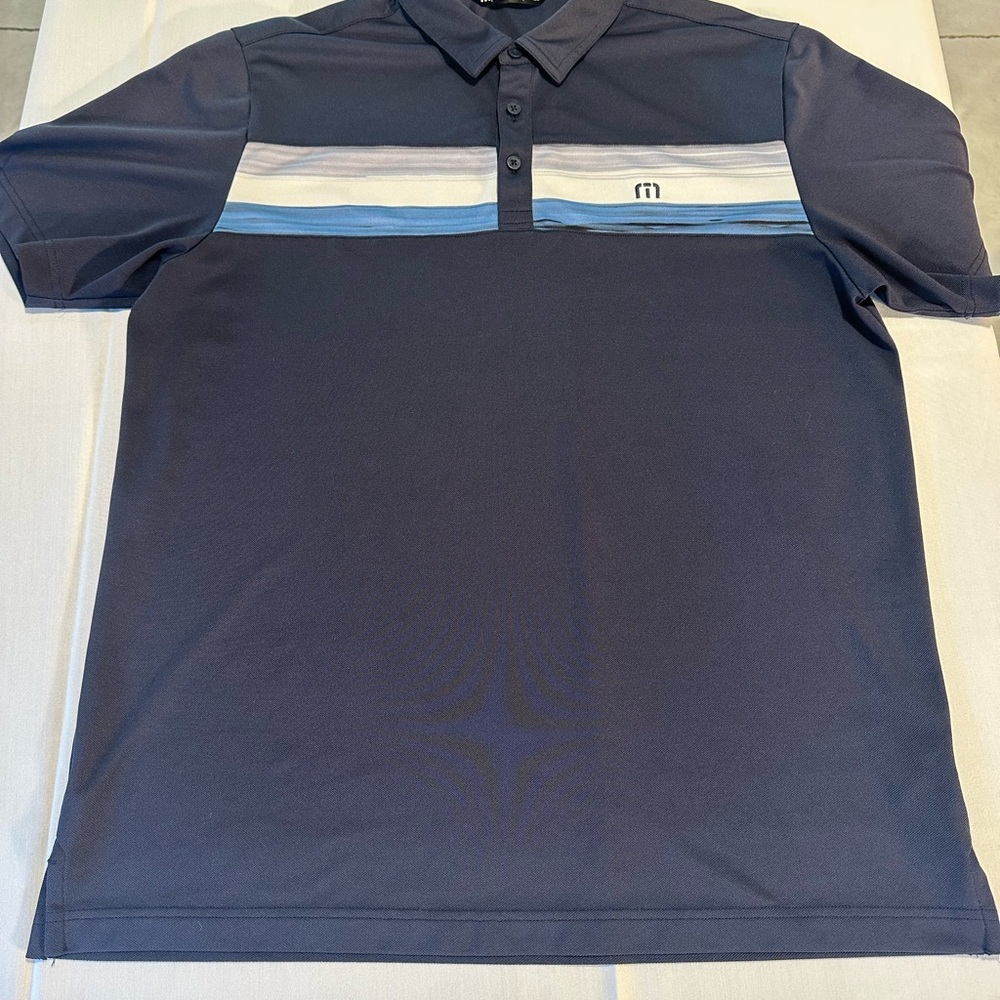 Travis Mathew Blue Polo Shirt with Sporty Stripes